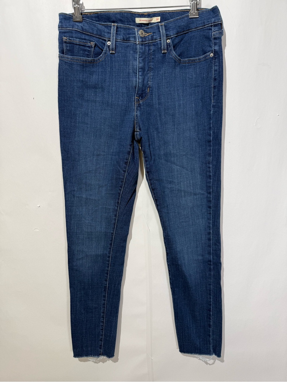 Levi’s 311 shaping skinny women’s jeans dark wash mid-rise stretch raw hem jeans